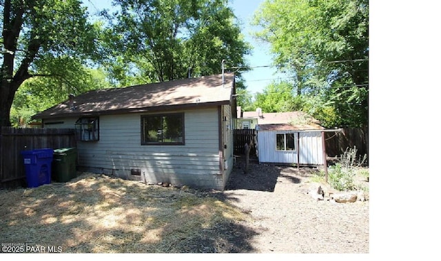 exterior space featuring a storage unit