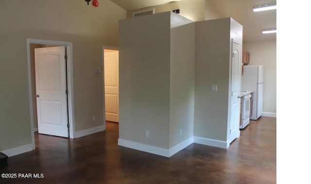 spare room featuring high vaulted ceiling