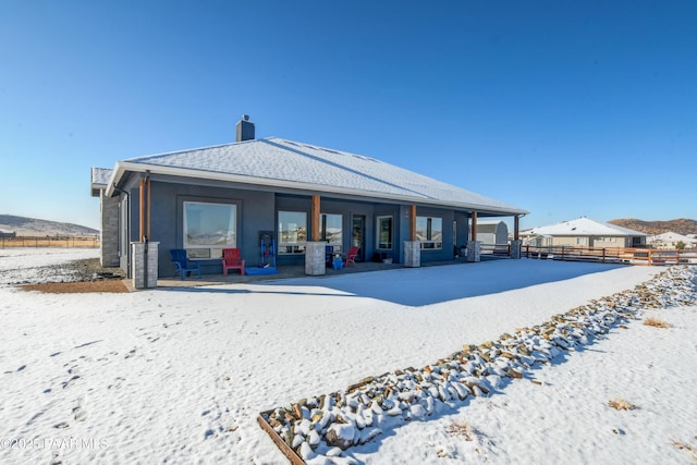 view of snow covered house