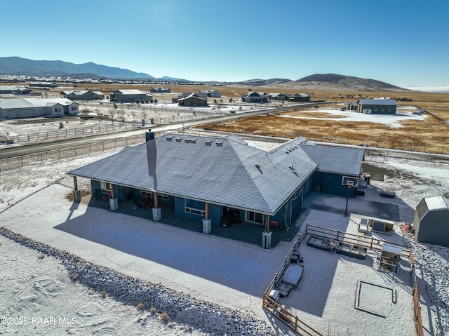 birds eye view of property featuring a mountain view