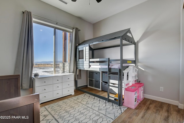 bedroom with light hardwood / wood-style floors