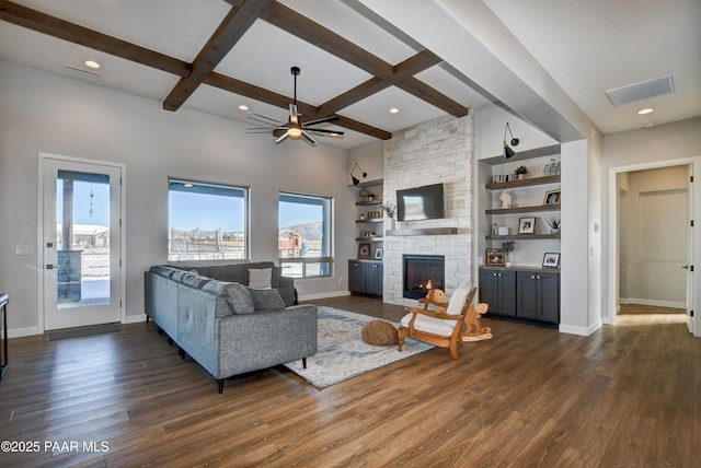 living room featuring coffered ceiling, a fireplace, dark hardwood / wood-style flooring, and beam ceiling