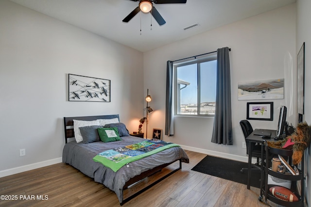 bedroom featuring hardwood / wood-style flooring and ceiling fan