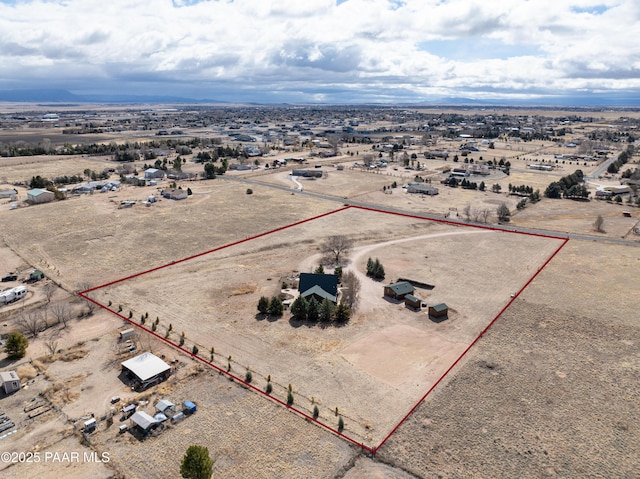 bird's eye view featuring a desert view and a rural view