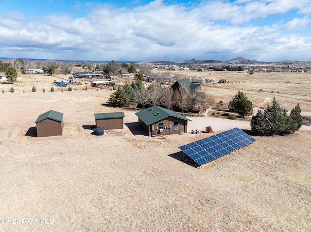 bird's eye view with a mountain view and view of desert