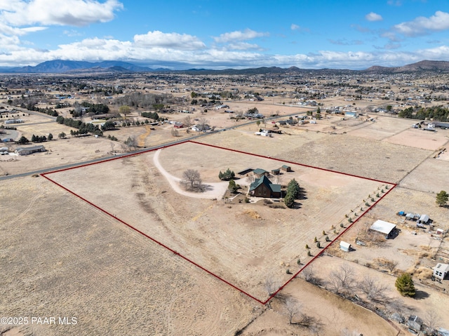 aerial view featuring view of desert and a mountain view