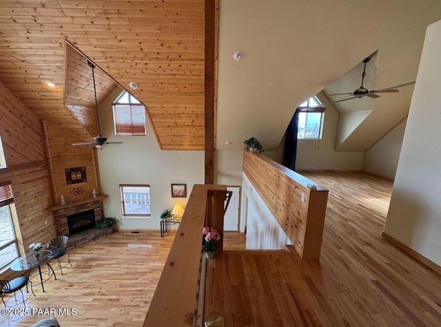 1740 W Bumblebee Rd, Chino Valley, AZ 86323 - bonus room featuring ceiling fan, a fireplace, wood finished floors, high vaulted ceiling, and baseboards