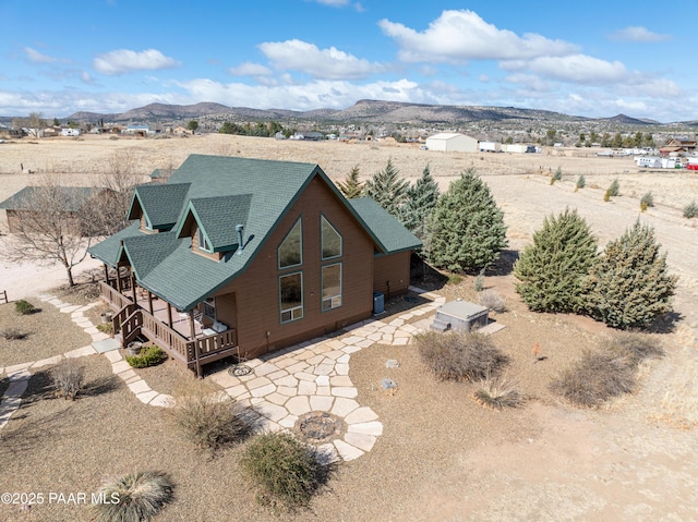 drone / aerial view with a mountain view and view of desert