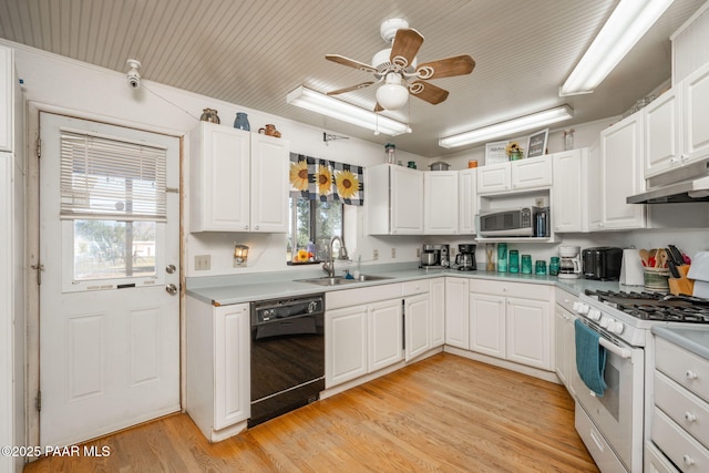 2049 N Maricopa St, Chino Valley, AZ 86323 - kitchen with black dishwasher, white gas range oven, stainless steel microwave, and healthy amount of natural light