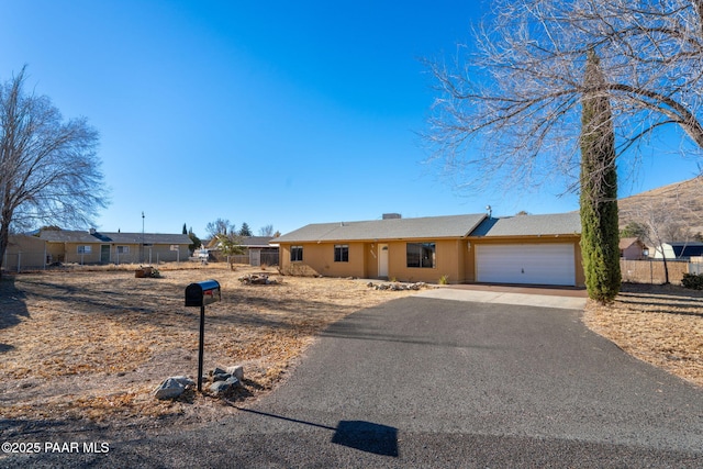 single story home with a garage