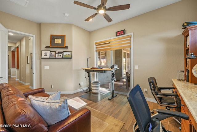 office with ceiling fan and light wood-type flooring