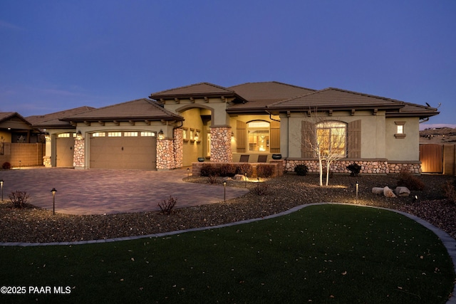 prairie-style home featuring a garage