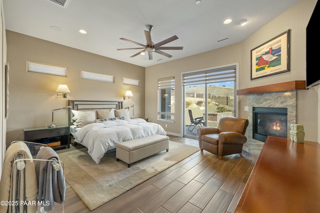 bedroom featuring access to exterior and ceiling fan