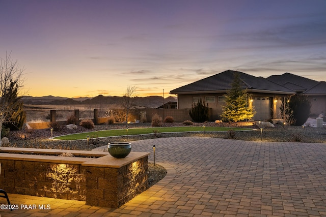 view of front of home featuring a garage and a mountain view