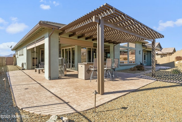 back of house with a bar, a patio, and a pergola