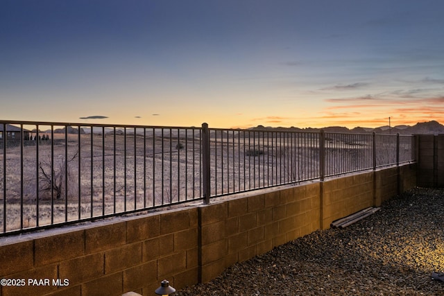 view of yard at dusk