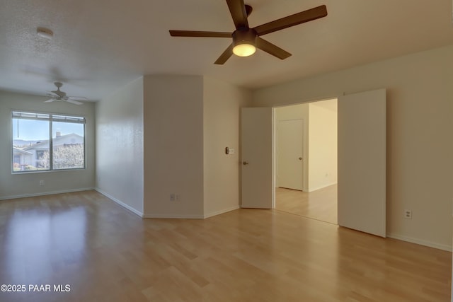 3160 Cascades Dr Unit 16H, Prescott, AZ 86301 - empty room with ceiling fan and light wood-style floors