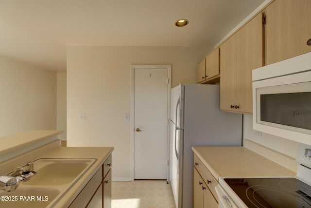 3160 Cascades Dr Unit 16H, Prescott, AZ 86301 - kitchen with white appliances, light countertops, light brown cabinetry, light floors, and recessed lighting
