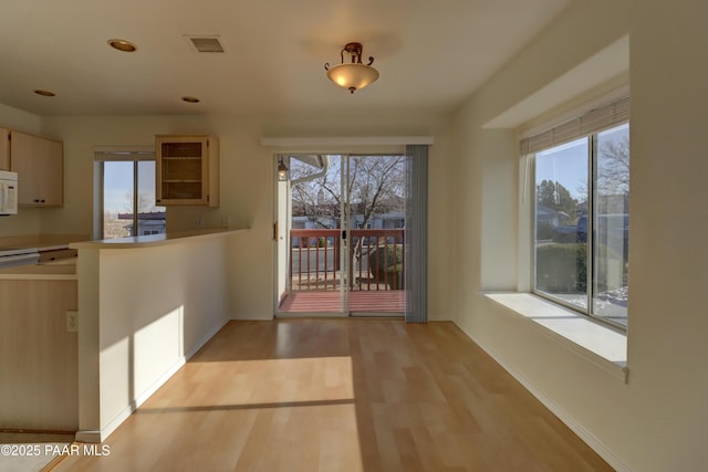 3160 Cascades Dr Unit 16H, Prescott, AZ 86301 - kitchen with white microwave, healthy amount of natural light, light wood-type flooring, and recessed lighting