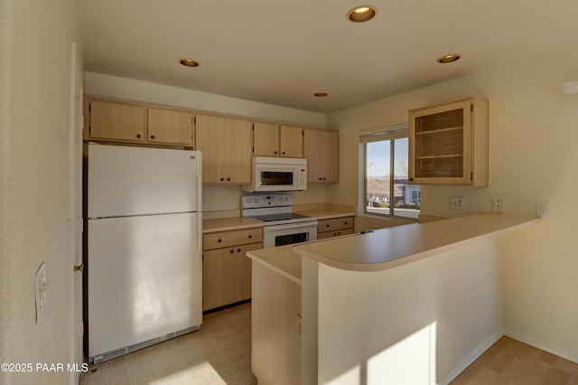 3160 Cascades Dr Unit 16H, Prescott, AZ 86301 - kitchen featuring white appliances, light brown cabinetry, light countertops, a peninsula, and recessed lighting