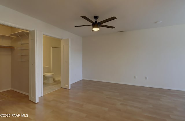 3160 Cascades Dr Unit 16H, Prescott, AZ 86301 - unfurnished bedroom featuring light wood-style flooring, a walk in closet, a closet, and connected bathroom