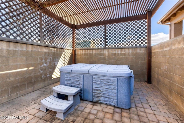 view of patio with a pergola and a hot tub