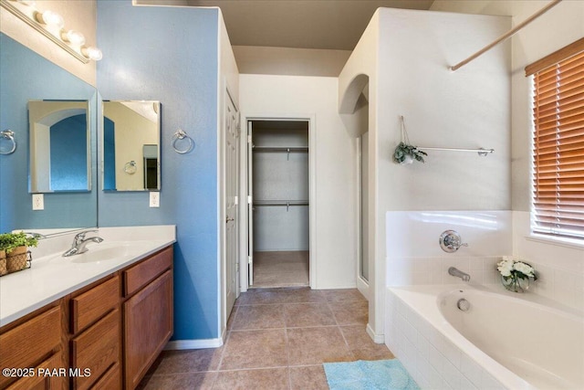 bathroom featuring vanity, tile patterned flooring, and plus walk in shower