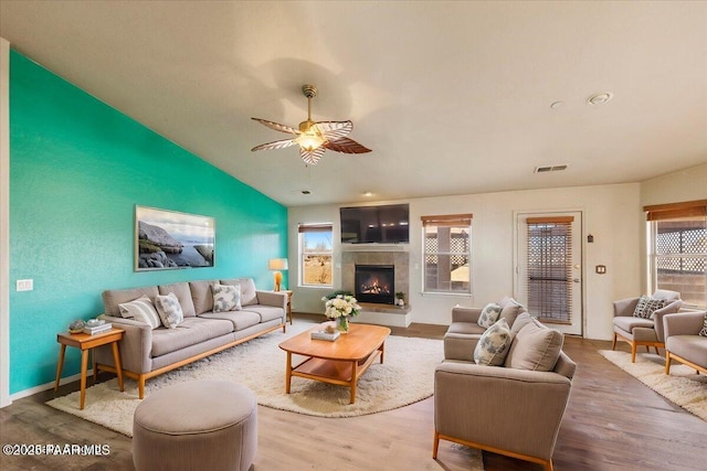 living room with ceiling fan, hardwood / wood-style floors, and a healthy amount of sunlight