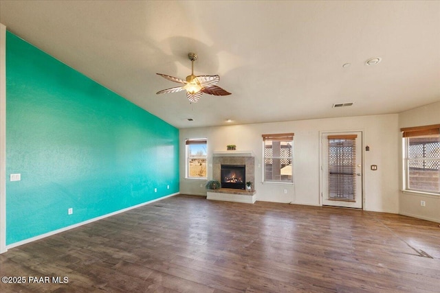 unfurnished living room with ceiling fan and dark hardwood / wood-style floors