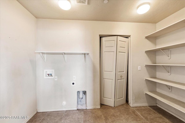 clothes washing area featuring gas dryer hookup, hookup for a washing machine, and hookup for an electric dryer