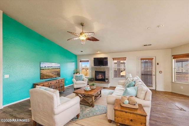 living room featuring ceiling fan and wood-type flooring