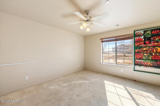 carpeted empty room with ceiling fan