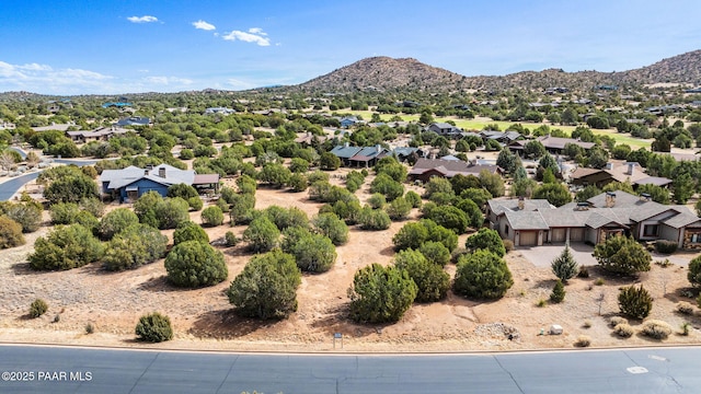 drone / aerial view featuring a residential view and a mountain view