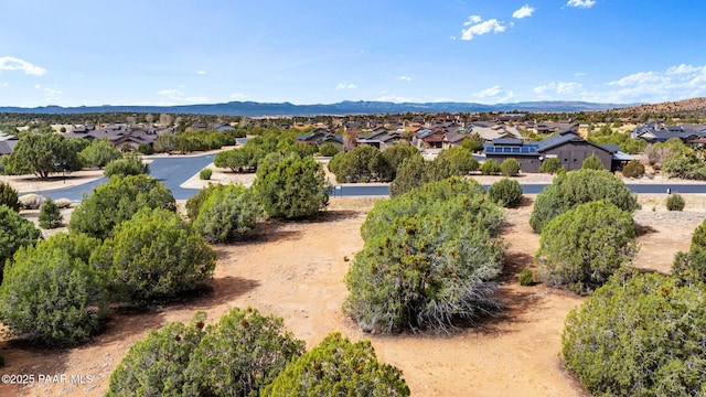 birds eye view of property with a residential view and a mountain view