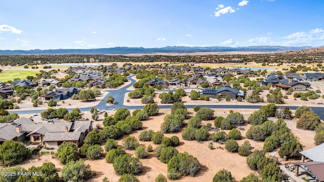 drone / aerial view featuring a residential view and a mountain view