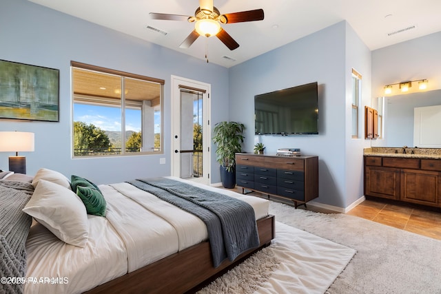 904 Daybreak Dr, Prescott, AZ 86303 - bedroom with a sink, access to exterior, ensuite bath, light tile patterned flooring, and a ceiling fan