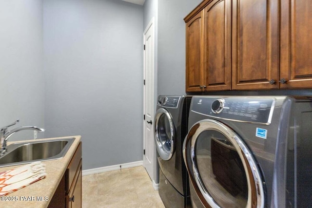 904 Daybreak Dr, Prescott, AZ 86303 - laundry area featuring independent washer and dryer, cabinet space, and baseboards