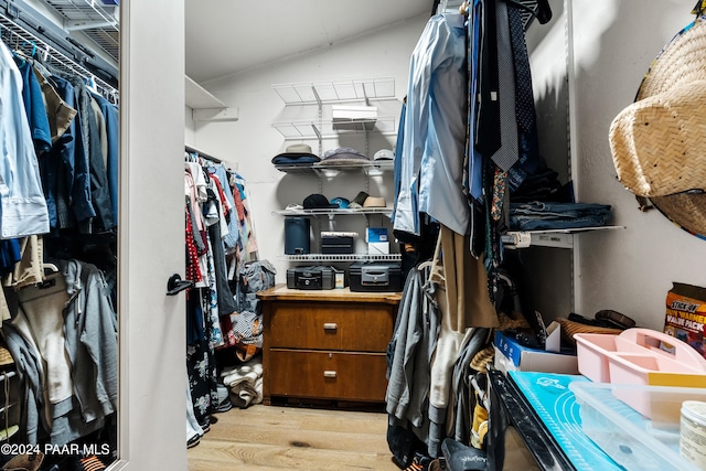 walk in closet featuring light hardwood / wood-style floors