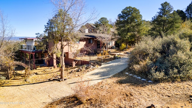 view of front of property with a balcony