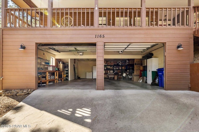 garage featuring a garage door opener and driveway