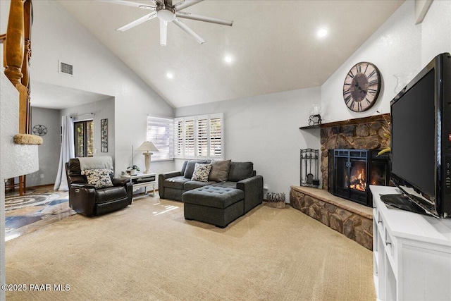 carpeted living room featuring high vaulted ceiling, visible vents, a ceiling fan, and a stone fireplace