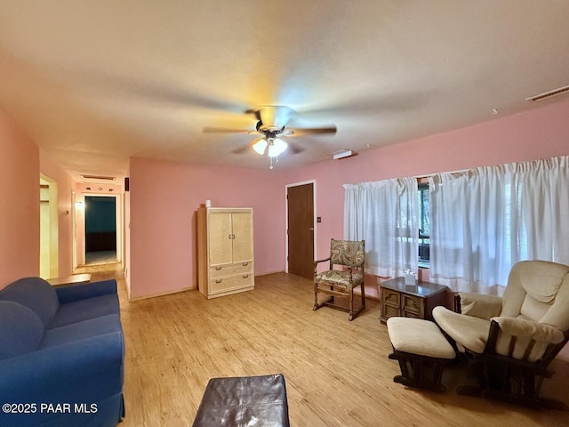 9495 E Marilyn Ln, Dewey-Humboldt, AZ 86327 - living room with light wood finished floors and a ceiling fan