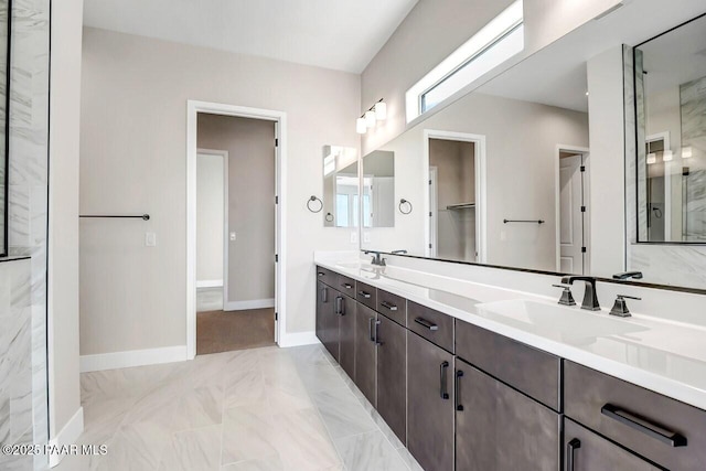 bathroom with vanity and a shower