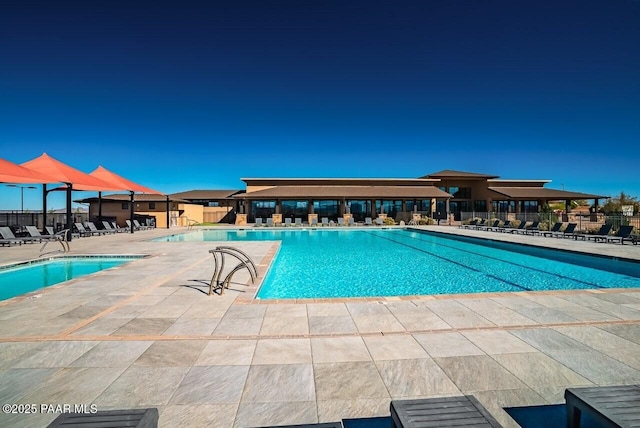 view of swimming pool featuring a patio area