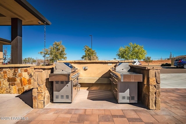 view of patio featuring grilling area and exterior kitchen