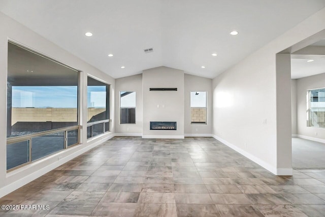 unfurnished living room with vaulted ceiling and a fireplace