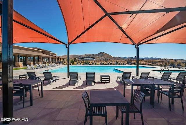 view of pool featuring a gazebo and a mountain view