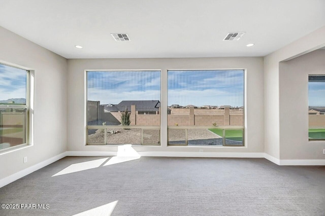 empty room with carpet flooring