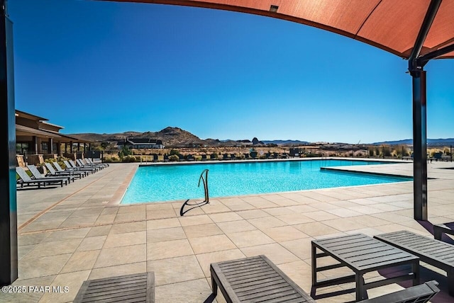 view of swimming pool featuring a mountain view