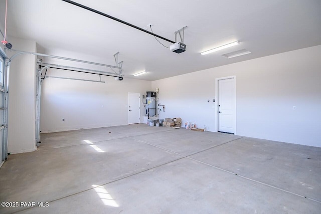 garage featuring a garage door opener and water heater